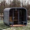 3M CUBE pirtis su terasÄ—le bei panoraminiu langu priekyje 3M CUBE sauna with a terrace